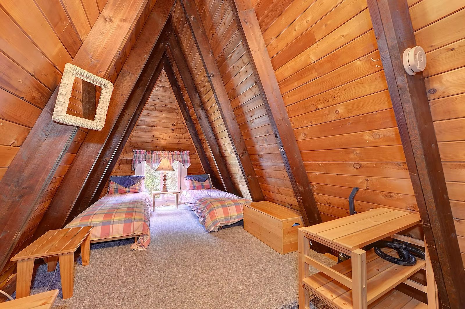 Shared A-frame cabin with twin beds under cedar rafters